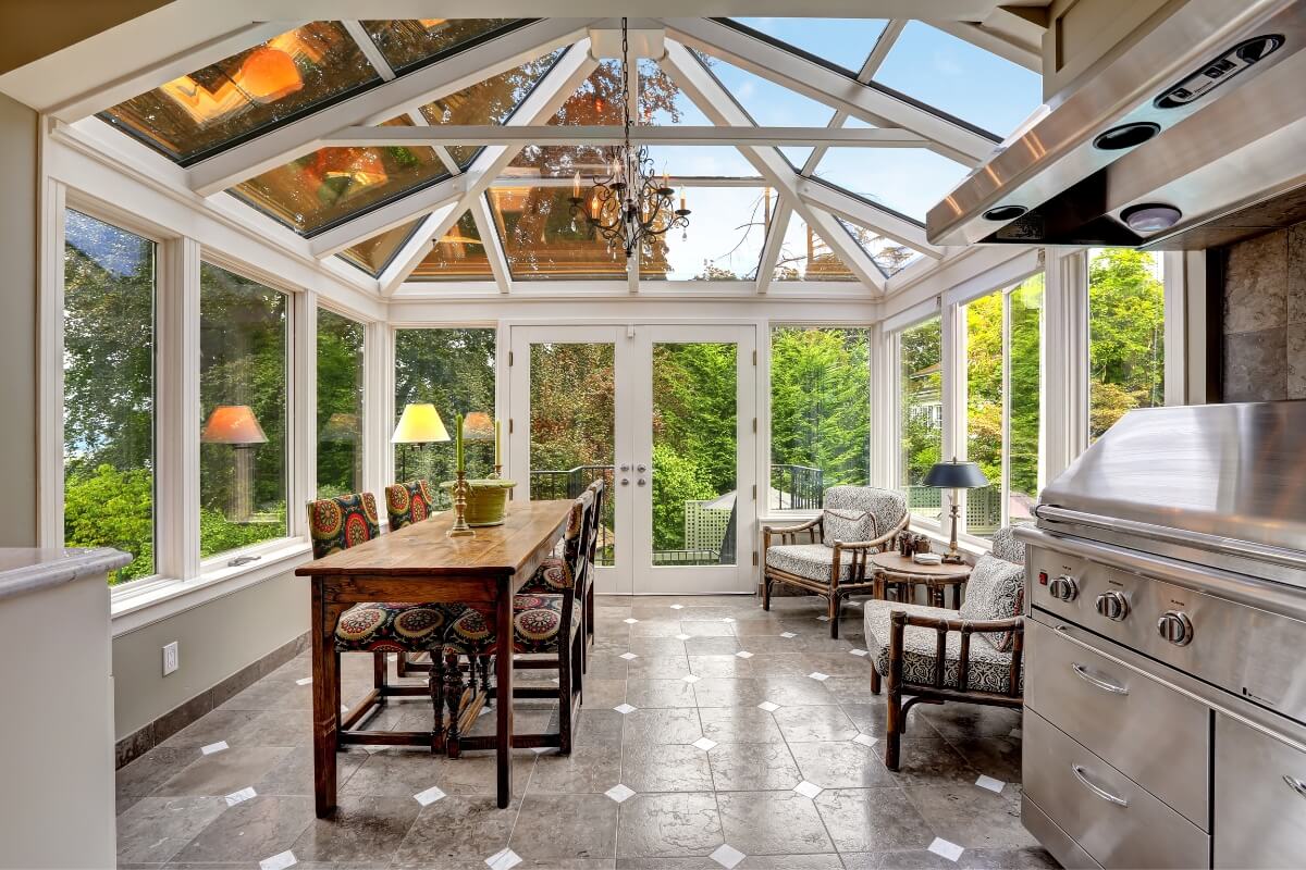 large sunroom with a table and chairs